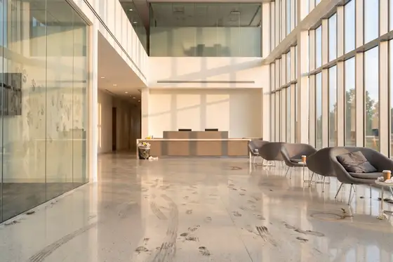 Commercial lobby showing accumulated traffic soil and dulled floor before a service reset